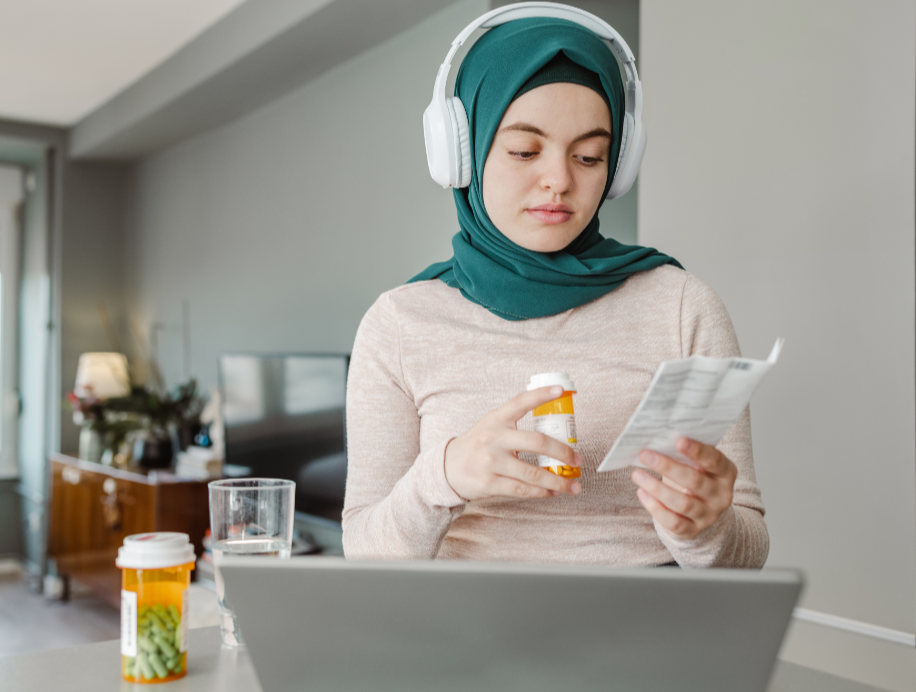 woman holding pill bottle